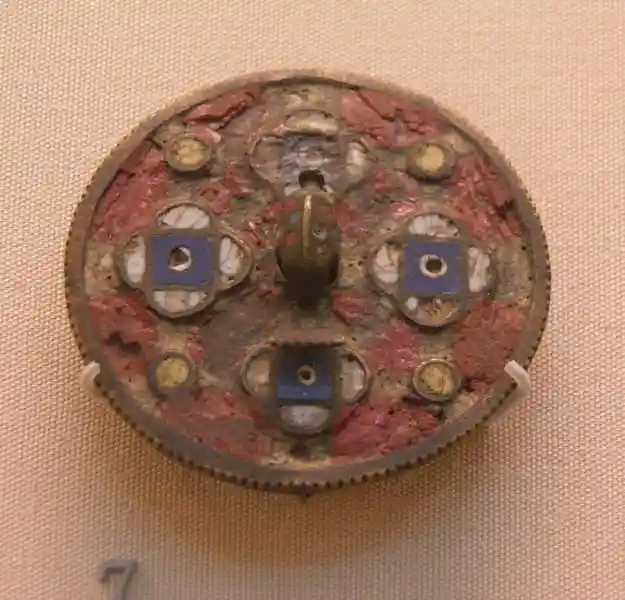 A brooch with solar disc and four cross